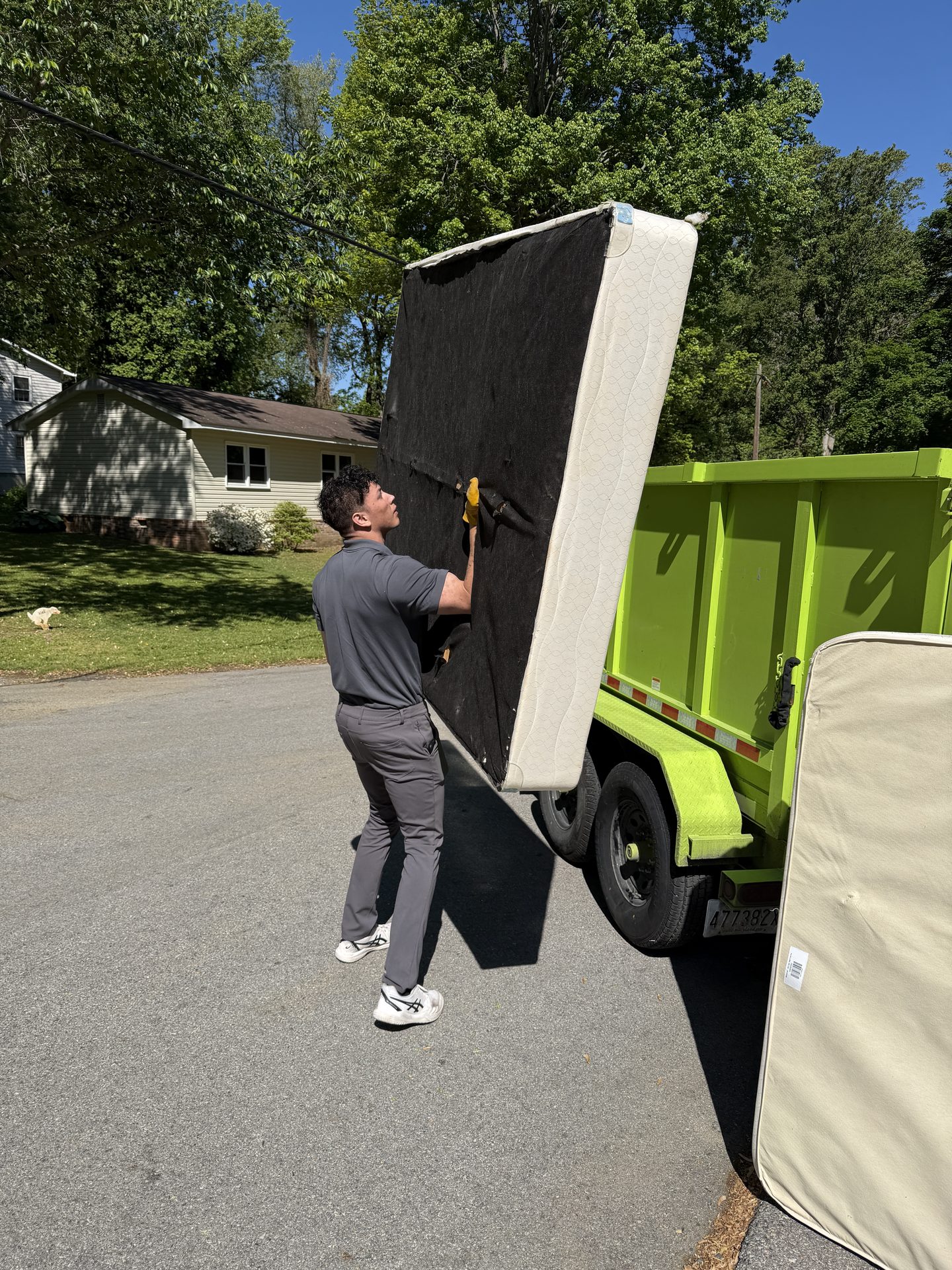 Loading old furniture into the truck during a furniture removal job