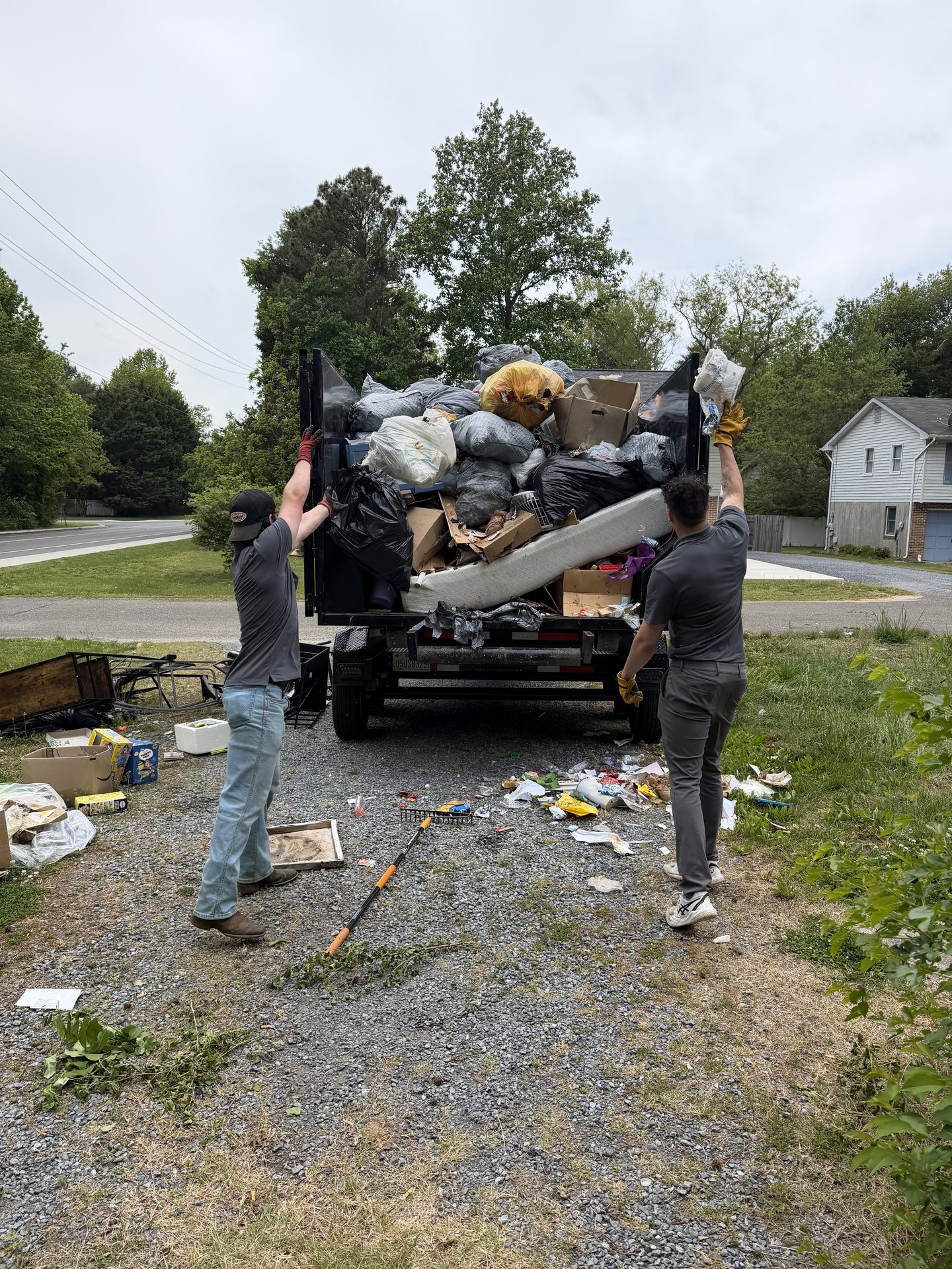 Critters & Clutter crew clearing a property during a full cleanout